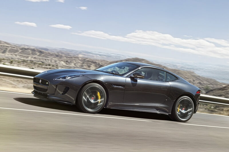 Jaguar F-Type Coupe side view mountain road driving