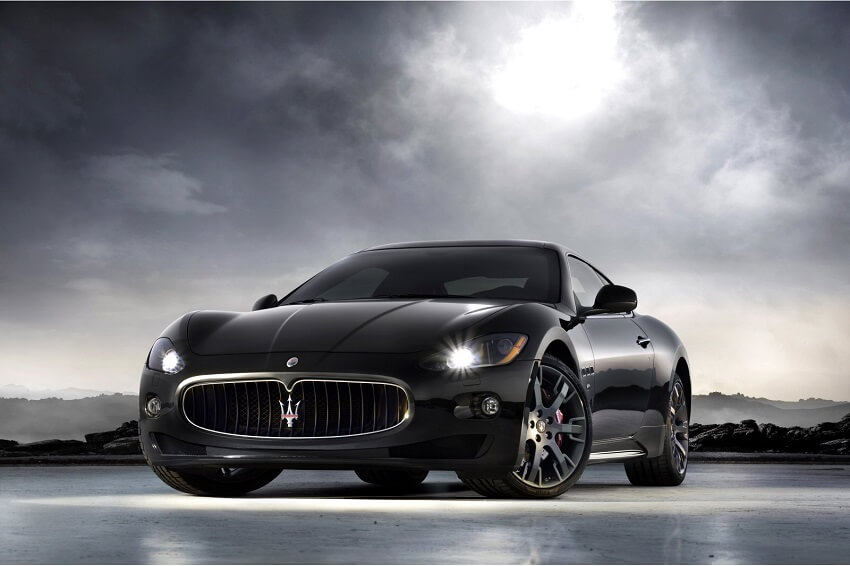 Maserati Granturismo front view dark headlights with cloudy sky