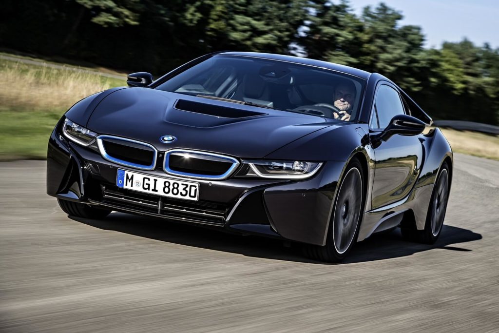 black BMW i8 driving round a corner on a track