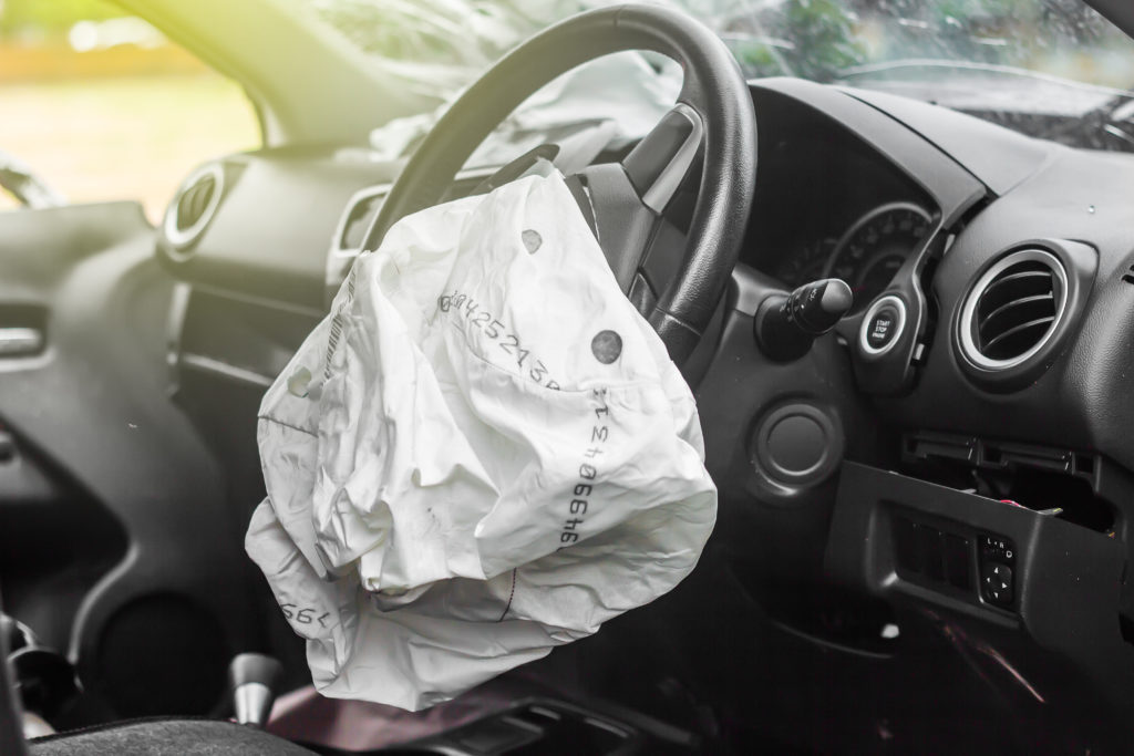 deployed airbag in a car