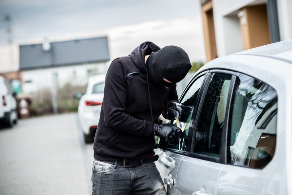 Thief breaking in to car