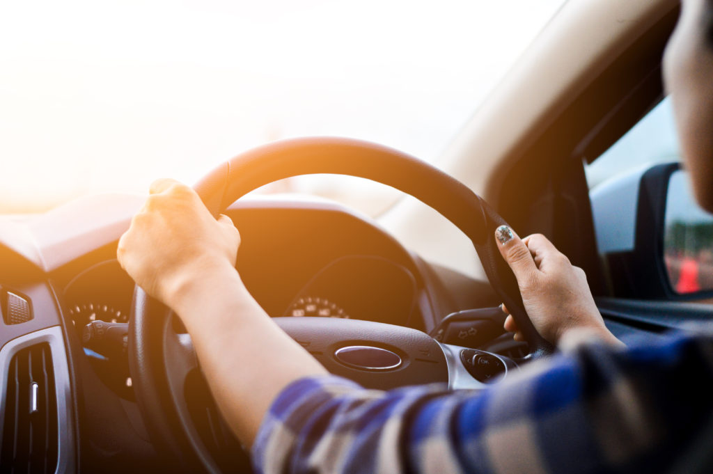 Lady driving hands on wheel