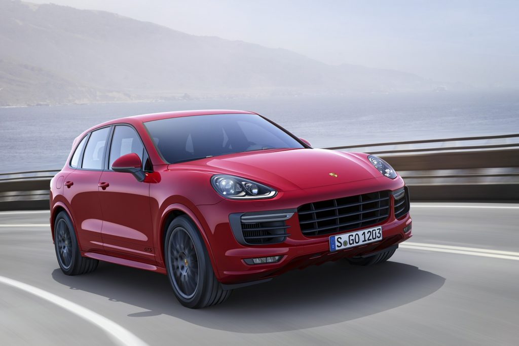 Porsche Cayenne red driving on the road