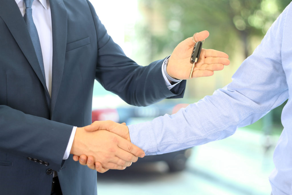 two men shaking hands after car deal - who are the bvrla