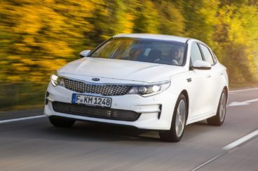 White Kia Optima Diesel Saloon driving on the road