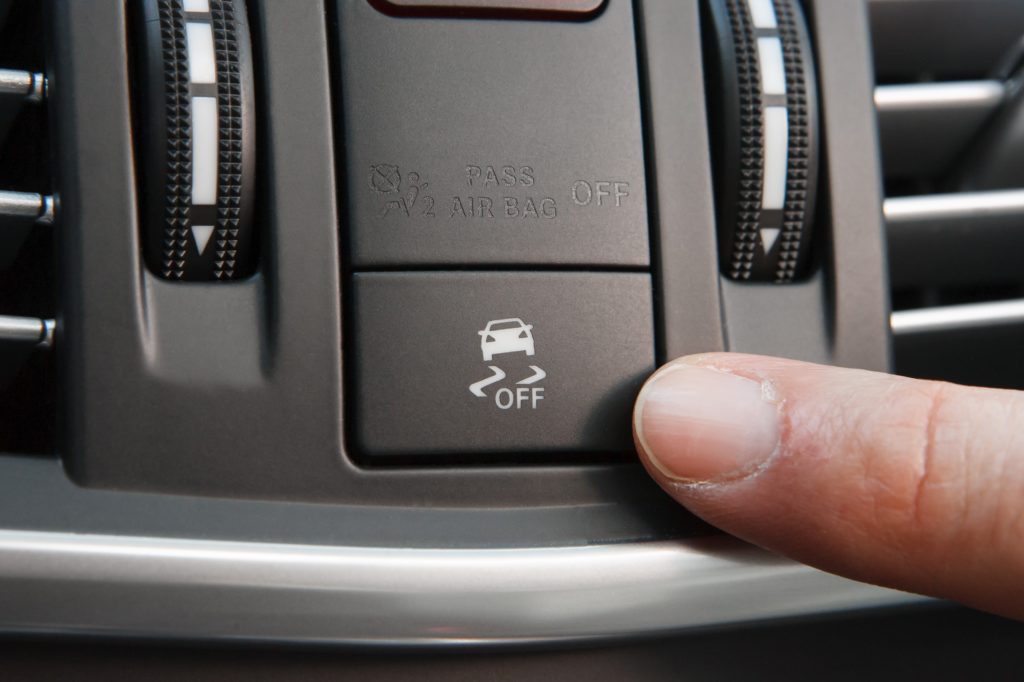 A cars dashboard and traction control button